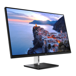 A modern monitor displaying a vibrant coastal village at sunset, showcasing the blend of technology with the beauty of nature's landscapes.