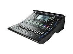 Digital audio mixing console with multiple knobs and sliders on a dark surface.