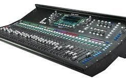Digital mixing console with multiple sliders and knobs for audio production.