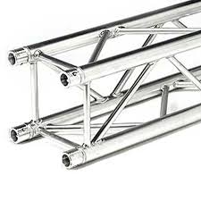 Metal truss sections for stage or structural support, intersecting and overlapping in a complex pattern.