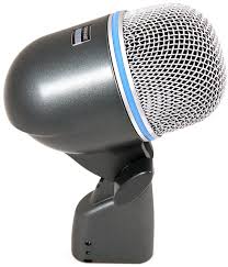A close-up of a dynamic microphone with a gray windscreen and a blue trim, mounted on a small black stand.