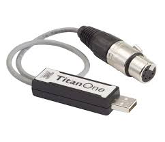 A usb device with a "titan one" label attached to a cable with a round, multi-pin connector.