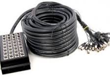 A multi-channel audio snake cable with xlr connectors coiled and ready for use in a professional sound setup.