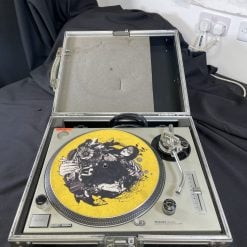 A pair of Ex-Hire Technics 1200 Mk2 vinyl turntables with graphic-designed vinyl records, encased in sturdy metallic briefcases, ready to spin tunes anywhere.