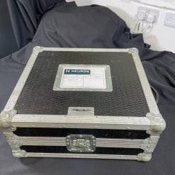 A sturdy, professional-looking black case with metal reinforcements and corners, labeled "Pair of Ex-Hire Technics 1210 Mk5 vinyl turntables," sits on a draped cloth surface, suggesting it's meant to transport or protect sensitive vinyl.